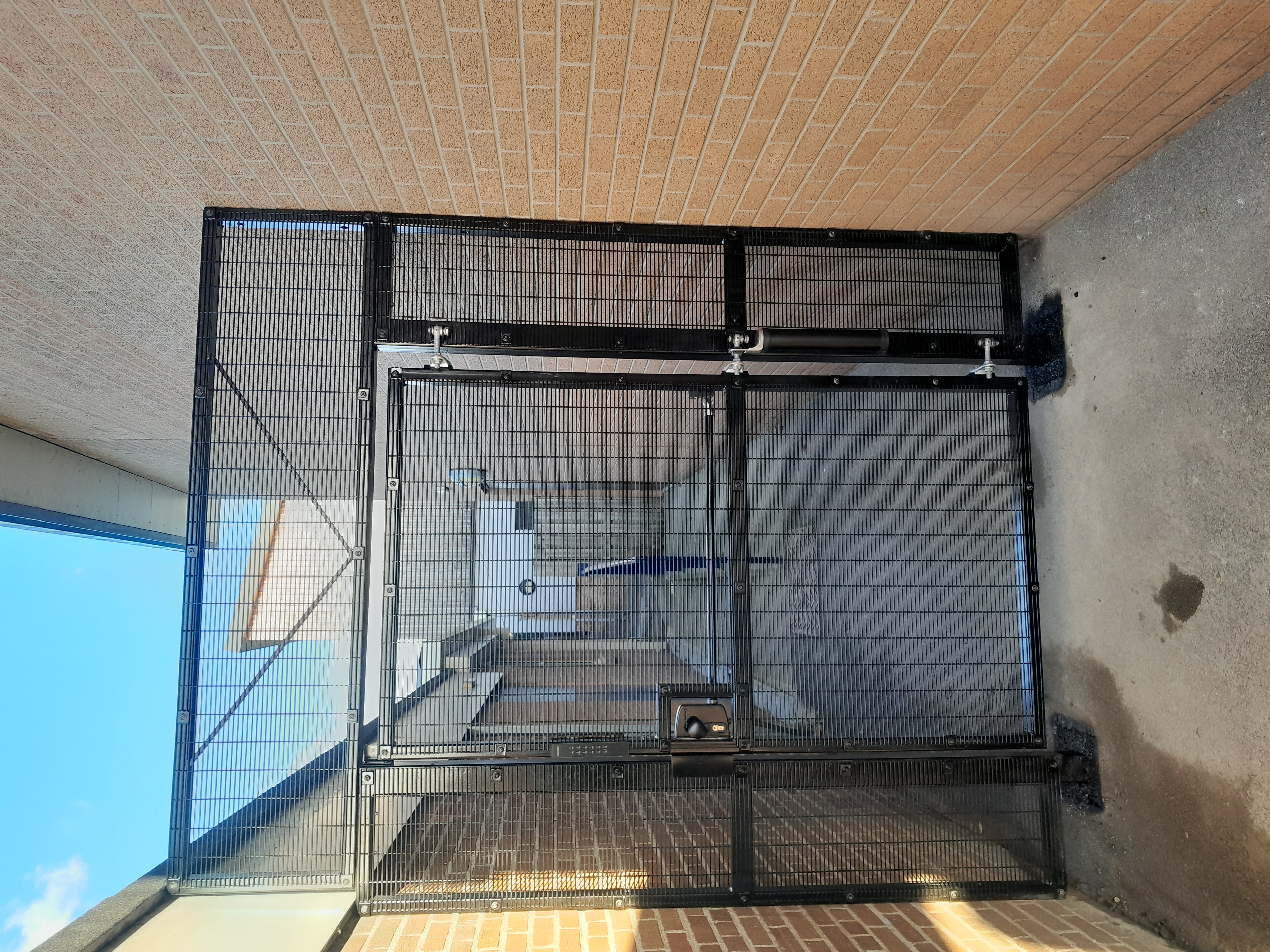 Off-grid access security gate with panic hardware